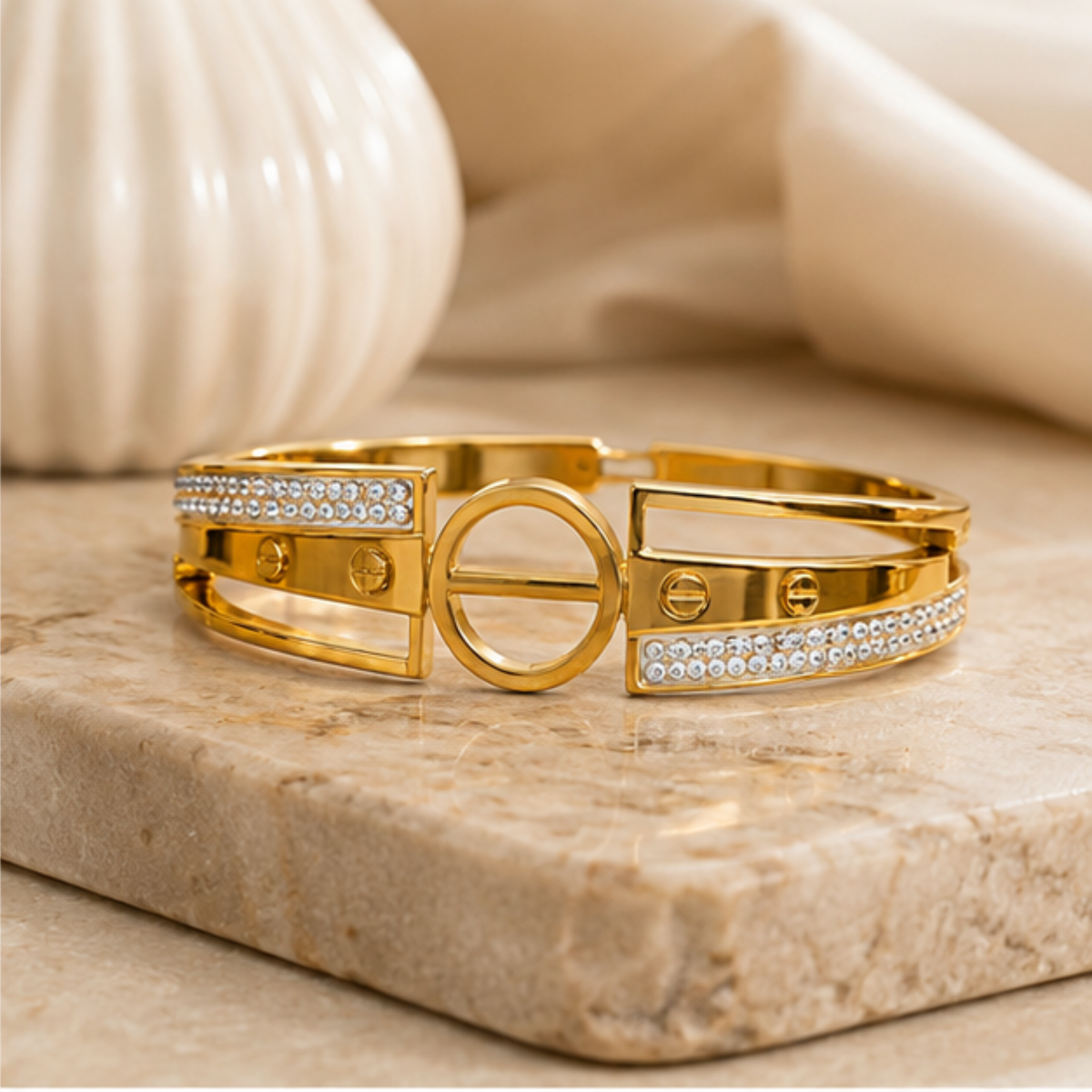 Elegant gold tone cuff bangle featuring geometric crystal detailing for women by Maelle