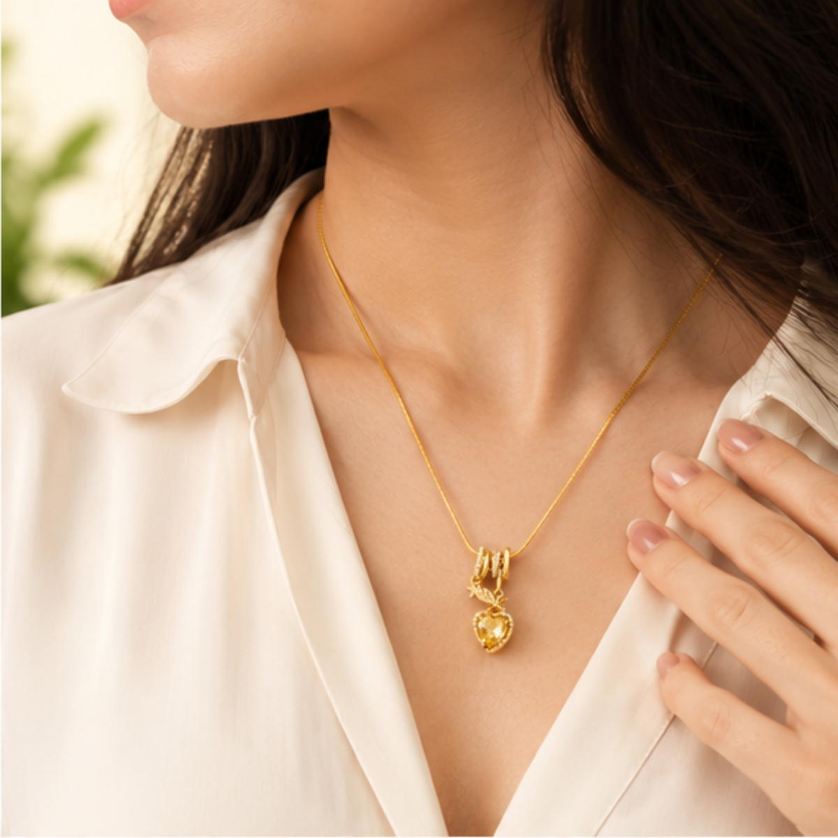 Elegant gold tone layered pendant necklace featuring delicate drop detailing for everyday wear
