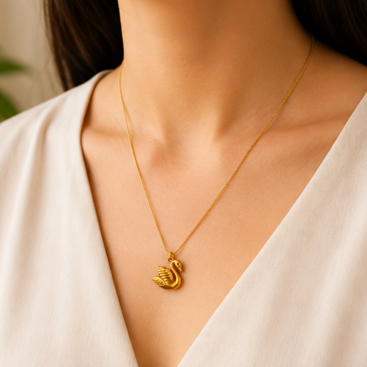 Elegant gold tone swirl pendant necklace for women with a delicate chain by Maelle