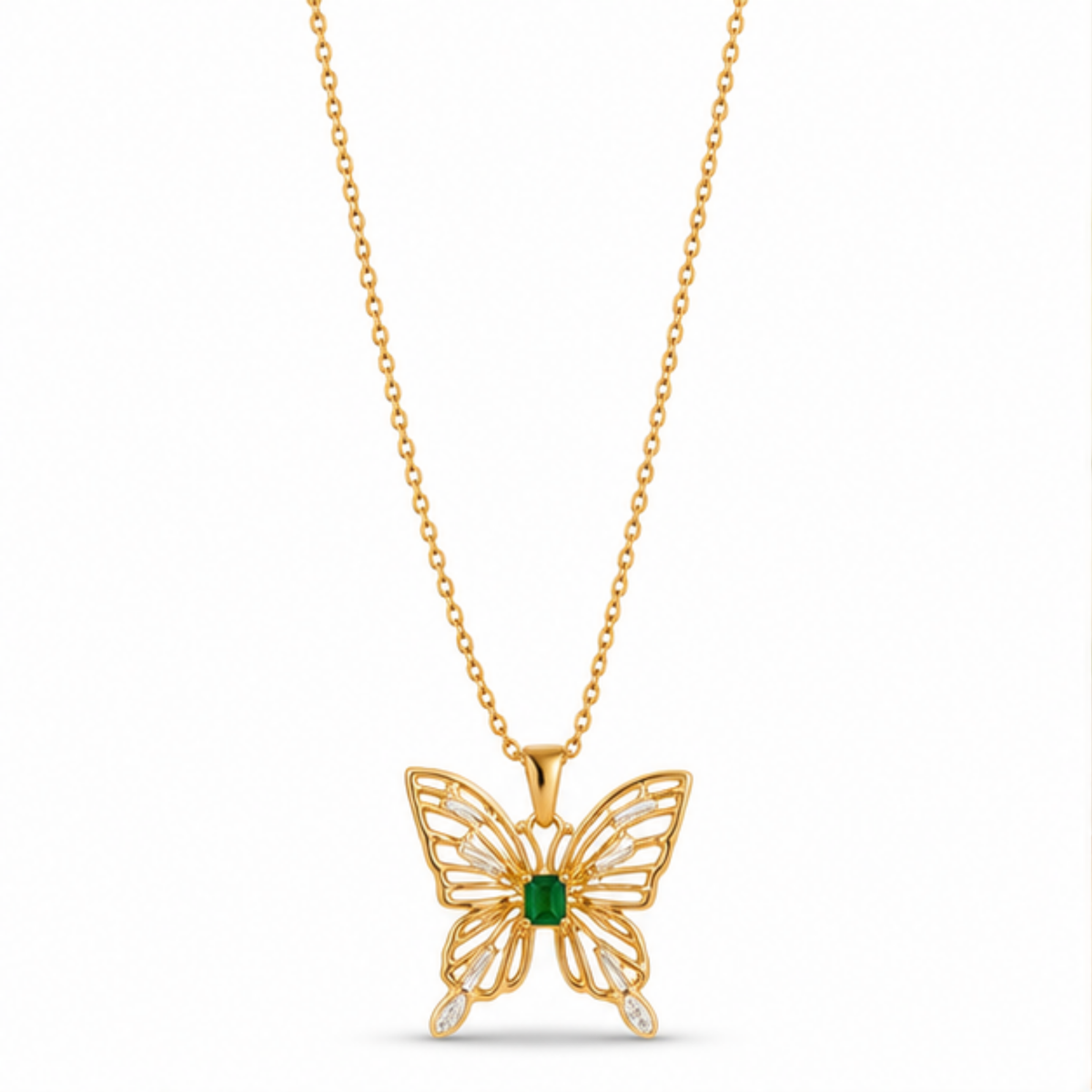 Maelle gold butterfly pendant necklace featuring a green rectangular gemstone and clear stone detailing