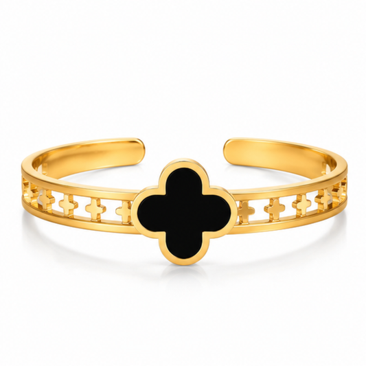 Maelle gold tone open cuff bracelet featuring a black clover design for women