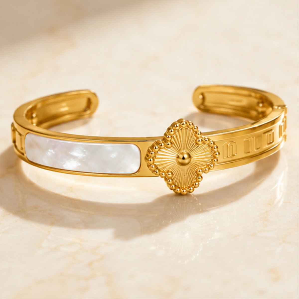 Gold tone floral open cuff bracelet designed for everyday elegance and sophisticated styling by Maelle