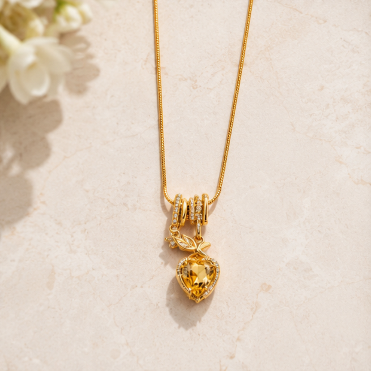 Elegant gold tone layered pendant necklace featuring delicate drop detailing for everyday wear
