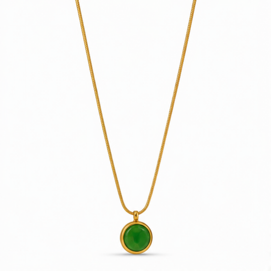 Maelle green round pendant necklace with a gold-tone chain on a white background