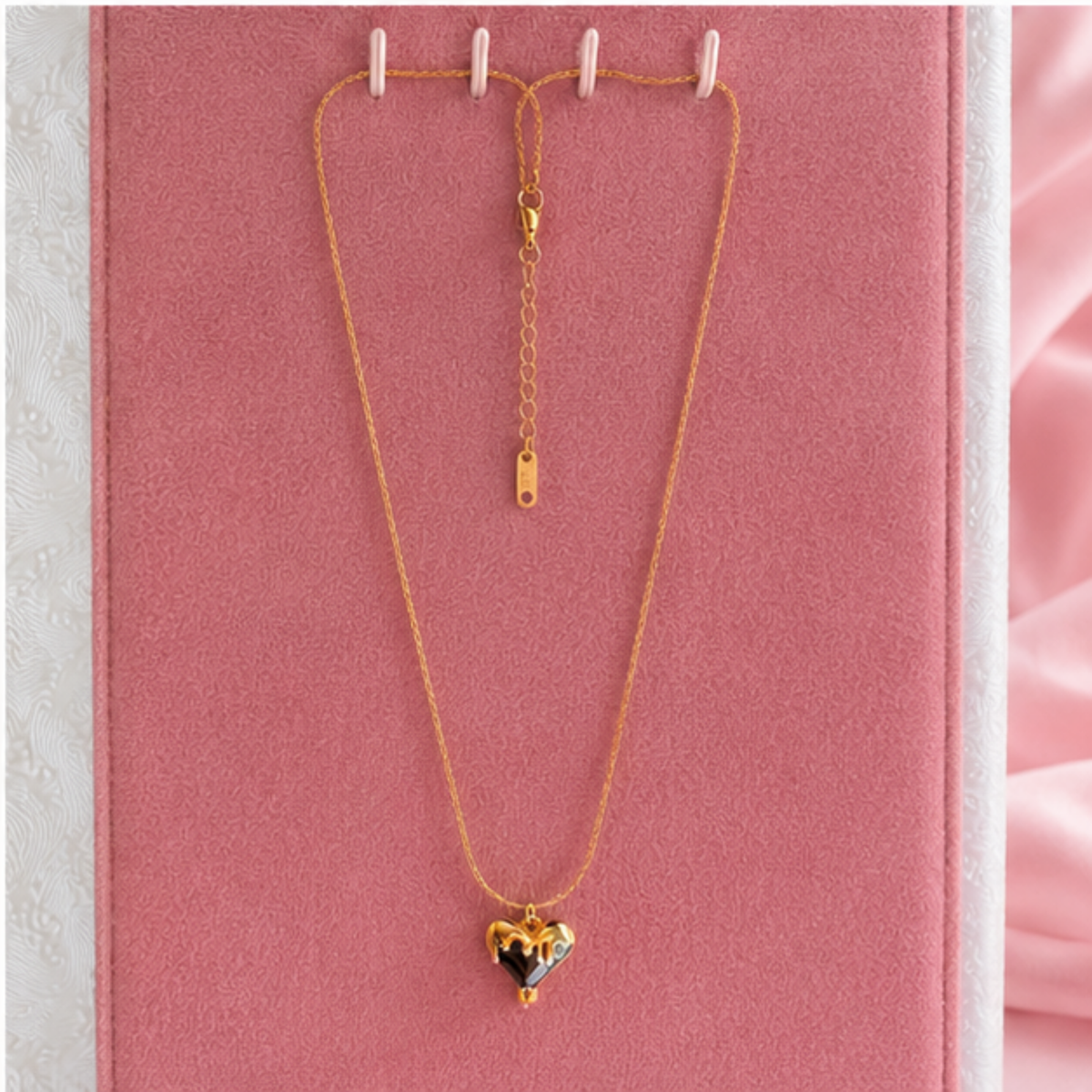 Minimal gold tone heart pendant necklace with a fine chain designed for everyday wear by Maelle